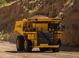 New Komatsu Dump Truck driving with dirt